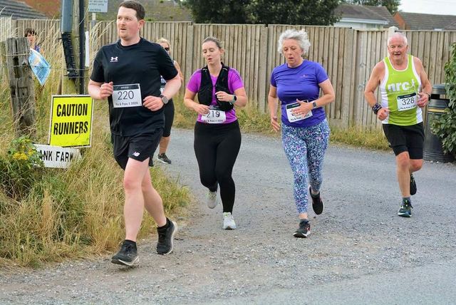 Runners on a gravel race trail