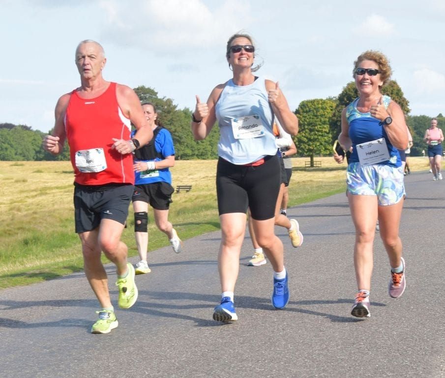 Runners following a path in the sunshine